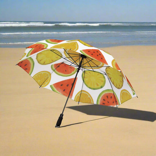 Umbrella with fruit pattern on a sandy beach